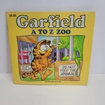 Garfield To Zoo Small Paperback Book Jim Davis Random House 1984. Fixed Price $9.99.