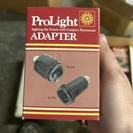 New Prolight 1500 Energy Saving Fluorescent Lamp Adapter 28 Watt. Fixed Price $10.00.